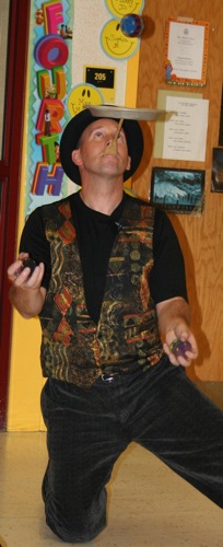 Juggling Balls around a Spinning Plate 